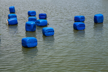 Plastic gallons using as buoys in the fishing farm