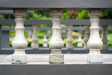 Fototapeta premium Close-up at row of stone pillar balcony of walkway in European luxury mansion. Gardening outdoor decoration object photo.