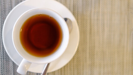 tea in white grass on the table