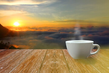 white coffee cup on wood floor against during sun rise landscape