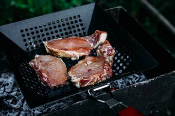 Pork bone steak cooked in a barbecue pan