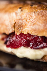 French baguette with hot Camembert cheese with jam