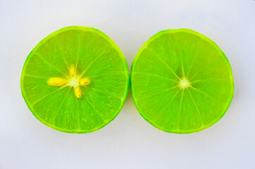 Double fresh lime, fresh lemon, half cut, isolated on white background