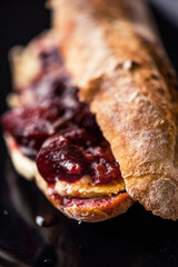 French baguette with hot Camembert cheese with jam