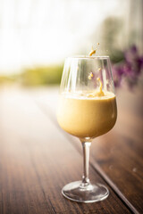 glass of ice turmeric latte