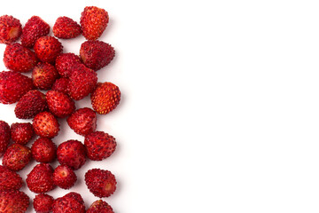 Macro view wild strawberry on white background. Forest red berries