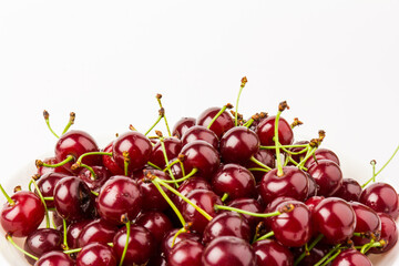 fresh red cherry fruit in plate  isolated on white background