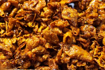 Close up of Dried squid with spicy and sweet sauce thai street food market