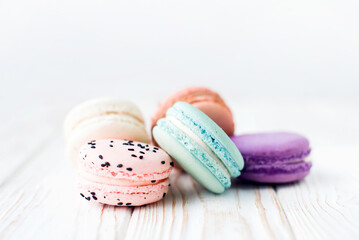 Close up view of tasty bright colored macaroon isolated on a white background. Sweet and colorful French macaroons. Dessert. Homemade sweets. Café dessert. Selective focus