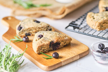 Triangle blueberry scones. a Traditional British baked good. set on cafe table.