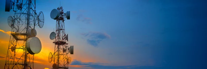 Foto op Plexiglas Telecommunication towers with wireless antennas on sunset sky © Yanawut Suntornkij