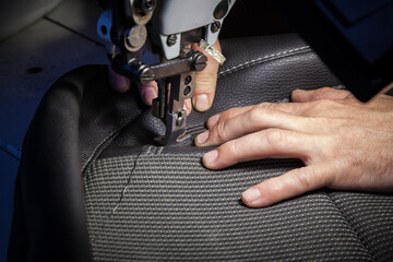 Tailoring of leather products. Repair of the car seat cover.