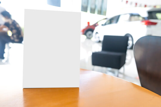 Mock up poster board stand on sales promotion advertisement sign white display on table in car show room, payment QR code signboard for customer deals announcement branding presentation marketing