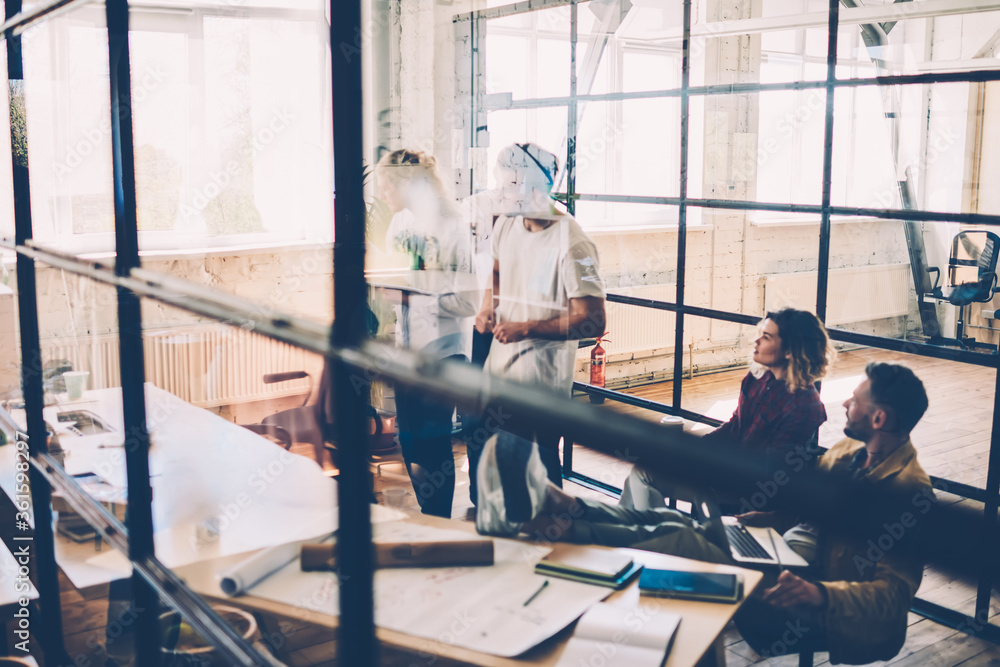 Aufkleber crew of architects working in modern coworking space solving problems with project planning, profess