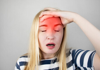 A woman suffers from headache or hypertension. The concept of treatment and prevention of migraine