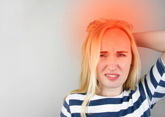 A woman suffers from headache or hypertension. The concept of treatment and prevention of migraine