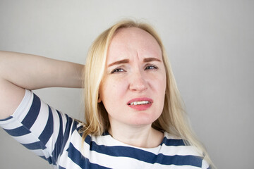 A woman suffers from headache or hypertension. The concept of treatment and prevention of migraine