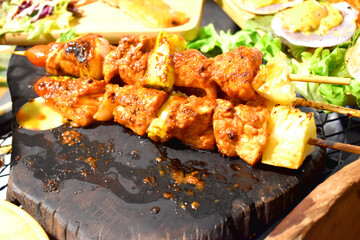 Selling barbecue on street food night market in Thailand