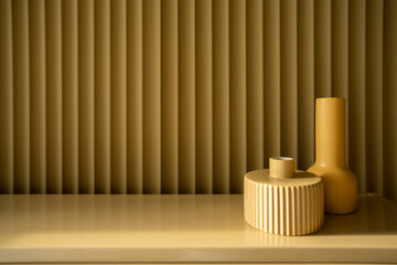 Bedroom working corner decorated yellow ceramic vase on mustard color corrugated wall in the...