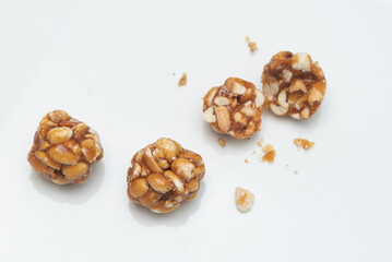 Peanut chikki balls or peanut brittle laddu delicious candy. Traditional sweet home made India, made by jaggery and peanuts or ground nuts blended together. Popular in Kerala South India