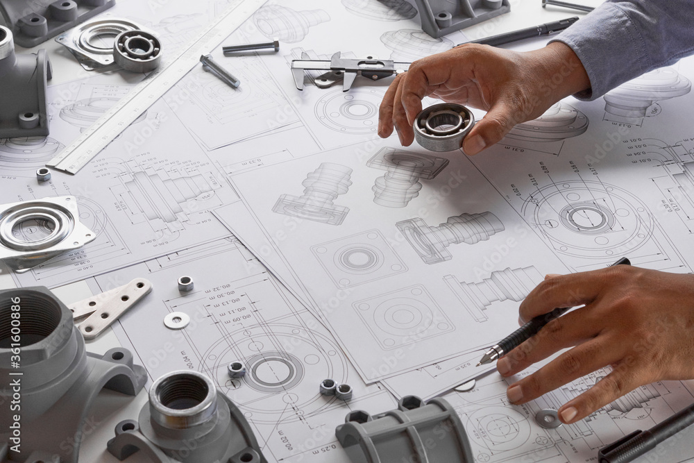Poster Engineer technician designing drawings mechanical parts engineering Engine.manufacturing factory Industry Industrial work project blueprints measuring bearings caliper tools