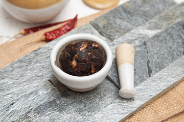 Tamarind paste or chutney, Imli or imalee crushed to paste served as a side dish for South Indian curry in Kerala Tamil Nadu India