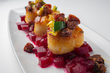close-up of scallops on beets
