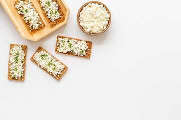 Cottage cheese toast on white desk top view copy space