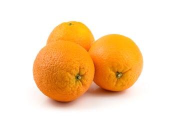 three oranges close-up on a white background, horizontal view