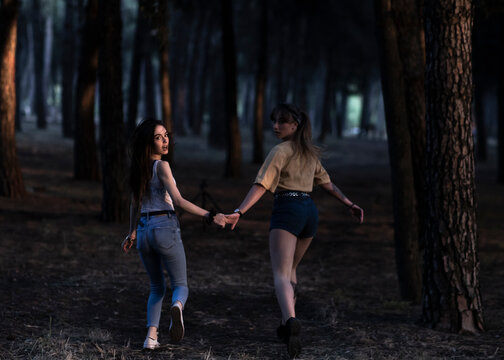 two girls in the forest flee terrified