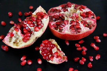 Pomegranate on the table, ripe pomegranate, sweet pomegranate, jam, vegetarianism, pomegranate on a saucer, chopped pomegranate.
