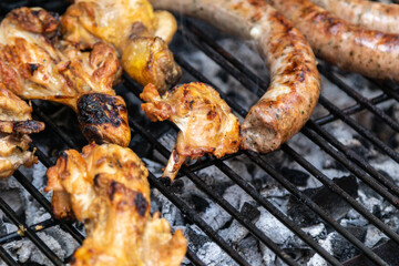 chicken and beef sausage, pork on a barbecue
