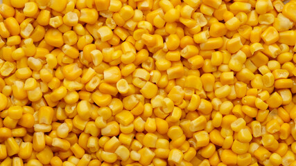 yellow canned corn as background. top view