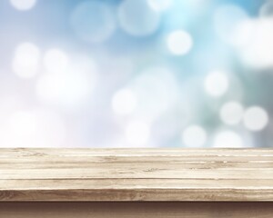 Wooden empty table top on bokeh background
