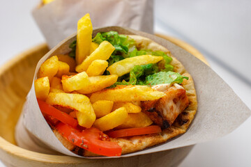 Grilled Chicken Gyros With Chips Bread Wrap Salad Tomatoes Seasoning Fries Wrapped Up Presented Wooden Greek Food Fast 