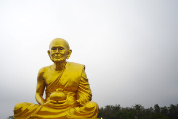 Big golden buddha statue called Luang Pu Tuad located in Nakhon Ratchasima province, Thailand.