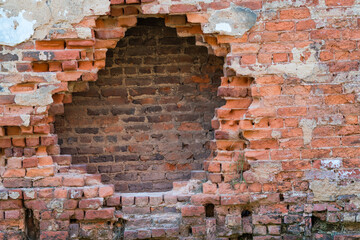 Red brick wall with hole in the middle, vintage looking wallpaper.