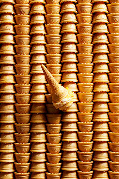 Ice cream cones with orange ice cream scoop