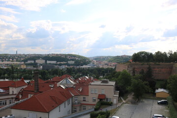 Fototapeta na wymiar Panorama of Prague and the Vltava river on a hot, cloudy summer day