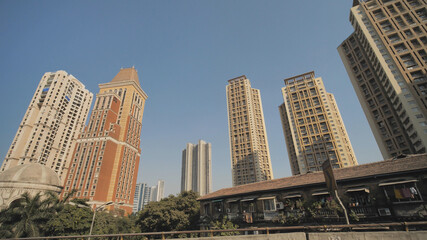 Fototapeta na wymiar Skyscrapers of Mumbai in motion from a car.