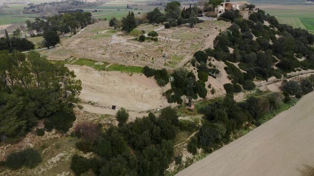 Drone shot of the monumental archeological museum in Ullastret and its astonishing beautiful landscape.