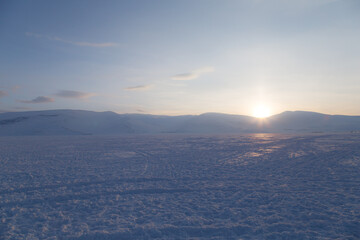 sunrise over the mountains in winter.