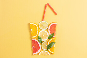 Creative concept of citrus juice, smoothie, summer drinks. Slices of orange, grapefruit, lemon and...