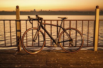  The only standing bike on the pier at sunset.