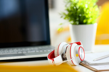 Empty remote office workplace with laptop pc and headset closeup. Receptionist or secretary of...