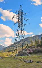 Support high-voltage power line. Mountain landscape