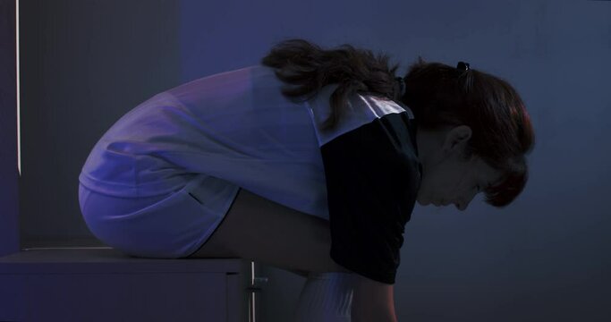 Female soccer football. Professional soccer football woman player put on her shoes in the dress room. 4k