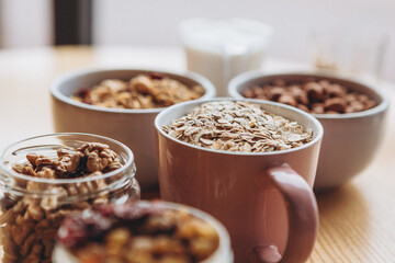 a delicious and crunchy oatmeal granola with honey, nuts, dried fruits and grains. Dynamic healthy food photography