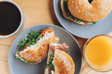 delicious and appetizing breakfast: a bagel stuffed on a plate