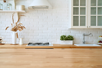 Kitchen wooden table top and kitchen blur background interior style scandinavian